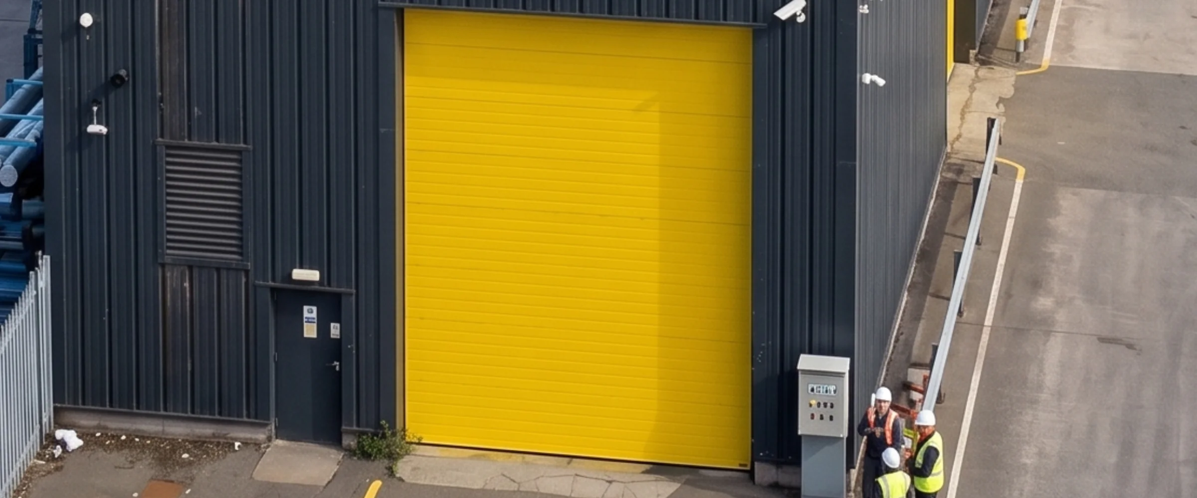 Pose porte sectionnelle industrielle SCI ANNAELLE à Gonesse par METAL 2000